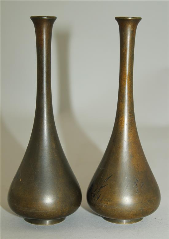 A pair of Japanese silver and gold inlaid bronze small bottle vases, Meiji period, 14cm